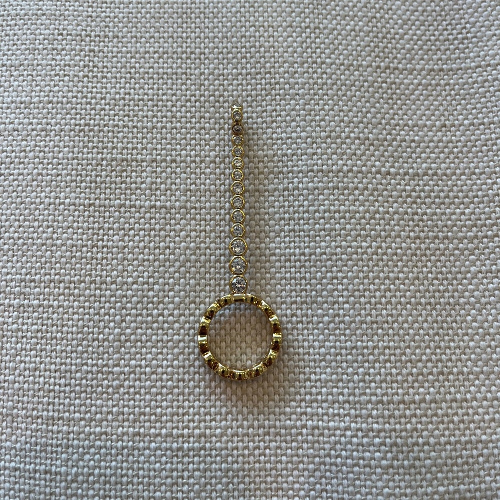 Gold plated cigarette holder (or joint holder) ring with clear stones.